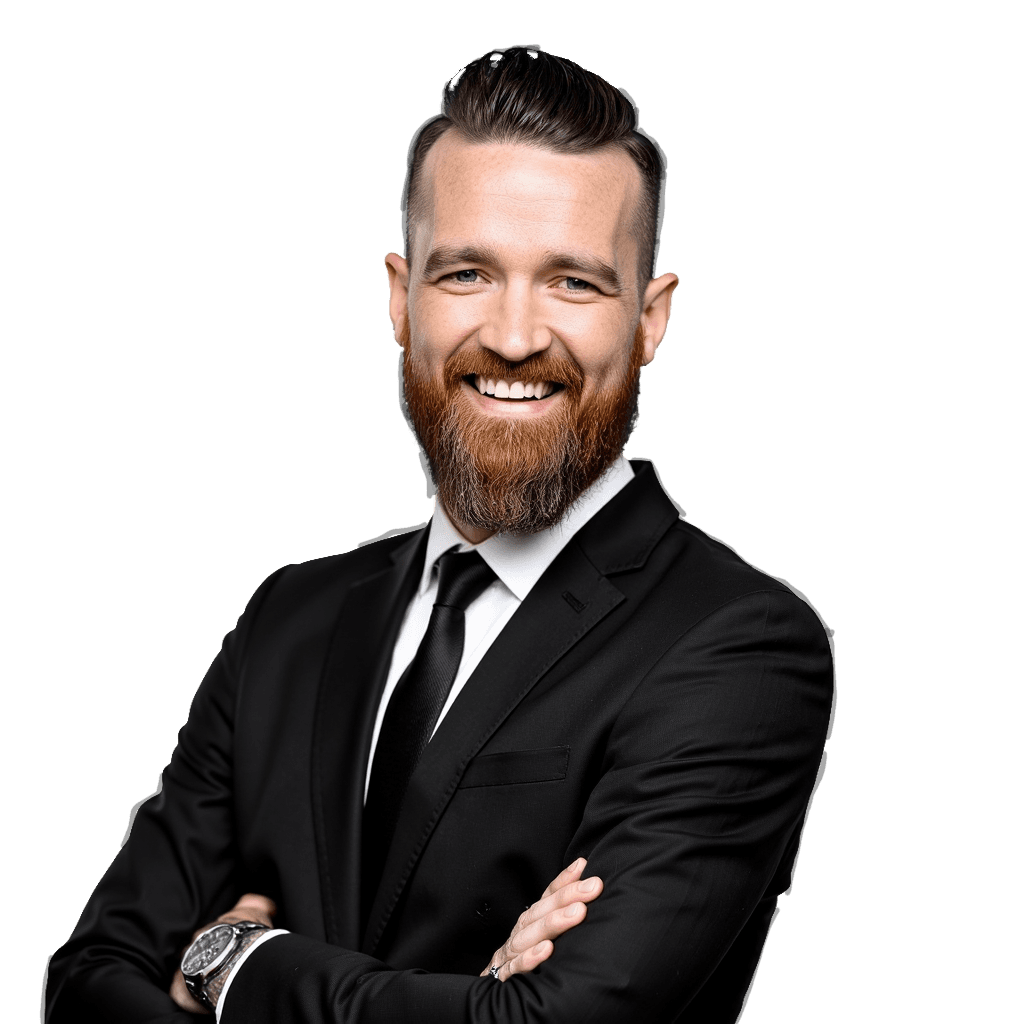 Spyder O'Neil, founder of Terratek Solutions, smiling with his arms crossed in a dark suit and tie.